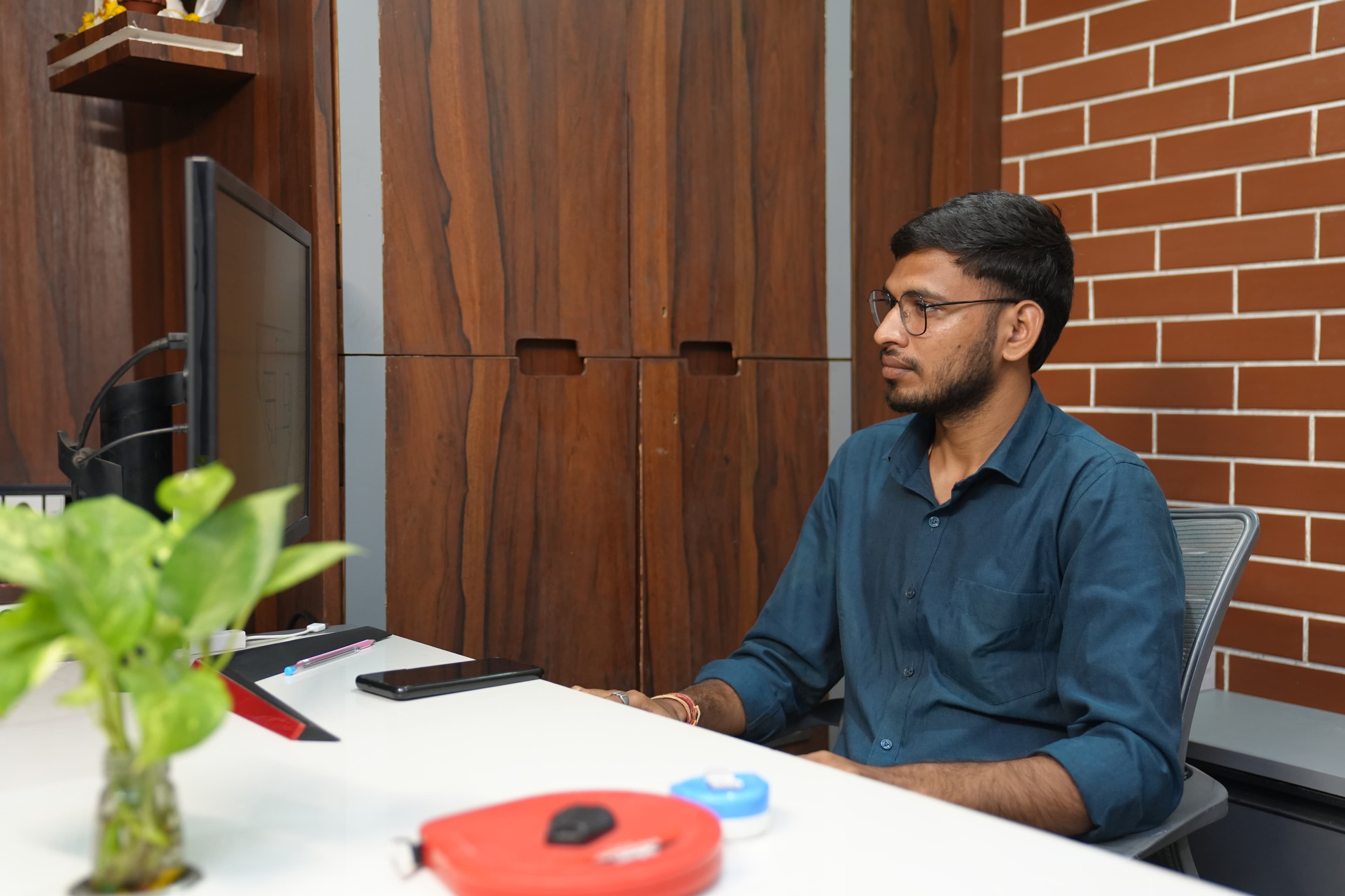Er. Narendra Vishwakarma, Structural Engineer at MRS Architects, at his studio desk.